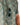 Close up on the Sunglasses Tab on the Muskied Outpost Button-Down Shirt on a model in front of a light gray background.