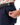 Close up on the Zippered pocket on the left leg of the Navy Ace Pants on a model in front of a white background