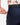 Close up on the Zippered pocket on the back left side of the Navy Ace Pants on a model in front of a white background