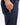 Close up on the Accessory pocket on the right leg of the Navy Ace Pants on a model in front of a white background