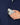 Close up on the model pulling a phone out of the front chest pocket on the Navy Endeavor Jacket on a model in front of a light gray background.