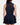 Back of the Navy Matchplay Mock Neck on a model in front of a light gray background.