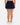 Back of the Pacesetter Skort on a model in front of a light gray background.