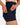 Model pulling phone out of the liner pocket on the Pacesetter Skort on a model in front of a light gray background.