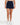 Front of the Pacesetter Skort on a model in front of a light gray background.