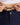 Close up on the waist drawstring on the Rhythm Pants on a model in front of a white background