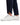 Close up on the ankle slit on the Rhythm Pants on a model in front of a white background