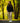 Model wearing the Navy Stride Jacket walking down a cart path with trees in the background.