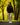 Model wearing the Navy Stride Jacket walking down a cart path with trees in the background.