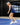 Model wearing the Navy Pacesetter Skort while playing pickleball