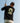 Model wearing the Odyssey T-Shirt outside golfing with blue sky as the background