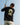 Model wearing the Odyssey T-Shirt outside golfing with blue sky as the background