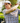 Male model wearing the Old Fashioned Polo on the golf course with greenery in the background
