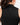 Close up on the back Waggle W logo on the Black Matchplay Mock Neck on a model in front of a light gray background.