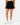 Front of the Onyx Pacesetter Skort on a model in front of a light gray background.