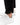 Close up on the ankle slit on the Rhythm Pants on a model in front of a white background