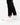 Close up on the ankle slit on the Rhythm Pants on a model in front of a white background