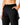 Close up on the elastic waistband on the Onyx Greenside Cargo Joggers on a model in front of a light gray background.