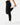 Side profile of the Onyx Greenside Cargo Joggers while a model is stretching in front of a light gray background.