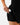 Close up on the model pulling headphones out of the liner pocket on the Onyx Momentum Shorts on a model in front of a light gray background.