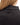 Back Waggle W emblem on the Onyx Plume Funnel Neck Sweatshirt on a model in front of a white background