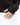 Close up on the thumb hole on the sleeve cuffs of the Onyx Plume Funnel Neck Sweatshirt on a model in front of a white background