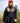Female Model wearing the Onyx Plume Funnel Neck Sweatshirt outside with greenery & sky in the background