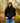 Model wearing the Onyx Waffle Knit Hoodie outside with greenery in the background.