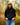 Model wearing the Onyx Waffle Knit Hoodie outside with greenery in the background.
