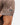 Waggle Logo on the left sleeve of the Outlaw Polo on a male model in front of a white background