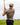 Model wearing the Outlaw Polo on the golf course with greenery & sky in the background