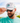 Model wearing the Pontoon Party Unstructured Rope Hat outside with greenery and blue sky as the background