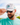 Model wearing the Pontoon Party Unstructured Rope Hat outside with greenery and blue sky as the background