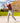 Model wearing the Rack Star Polo on the course hitting out of a bunker, with trees and fairway in the background.