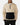 Front of the Sandstone Surge Pullover on a model in front of a light gray background.