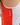 Close up on the Waggle logo on the right side of the Scarlet Crossover tank on a Model in front of a white background