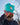 Model wearing the Scoop Hat doing a hat tilt with blue sky in the background.