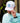 Model wearing the Shred with Sass Rope Hat outside with greenery and a building in the background