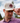 A male model wearing the Smoaked It Hat with greenery & blue sky in the background