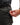 Close up on the Zippered pocket on the left leg of the Ace Pants on a model in front of a white background