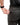 Close up on the Zippered pocket on the back left side of the Ace Pants on a model in front of a white background