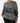 Front of the Squatch Wildknit Sweater on a Female Model in front of a light gray background.