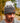 Model wearing the Squatch Wool Beanie outside with greenery in the background.