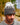 Model wearing the Squatch Wool Beanie outside with greenery in the background.