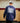 Male model wearing the Sticks in the Middle Long Sleeve T-Shirt walking out of a hockey locker room