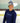 Female model wearing the Sticks in the Middle Long Sleeve T-Shirt skating on a hockey rink