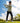 Model wearing the Stone Sunday Quarter Zip on the golf course with greenery and blue sky in the background