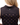 Back waggle patch on the Sunday Scramble Women's Sleeveless polo on a model in front of a white background