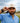 Conner wearing the Turn Hat on the golf course, with greenery and cloudy sky in the background.