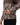 Camouflage jacket with a pattern of brown, beige, and black on a white background